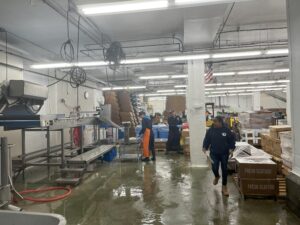 Workers in a seafood processing facility